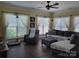 Comfortable living room featuring hardwood floors and large windows with natural light at 103 Doyle Farm Ln, Mooresville, NC 28115