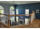 Second story view of living room, featuring high ceilings and large arched windows at 103 Doyle Farm Ln, Mooresville, NC 28115