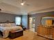 Main bedroom showing a glimpse into the ensuite bathroom and furnishings at 103 Doyle Farm Ln, Mooresville, NC 28115