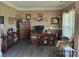 Inviting office with warm colors, built-in shelving, and a comfortable seating area, perfect for productivity at 103 Doyle Farm Ln, Mooresville, NC 28115