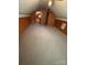 Large, empty attic space with wood paneling and ample room for storage or customization at 103 Duke St, Great Falls, SC 29055