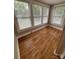 Inviting bedroom featuring hardwood flooring and multiple bright windows at 103 Duke St, Great Falls, SC 29055