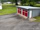 Two-bay detached garage with vibrant doors and ample parking space and storage opportunities at 103 Duke St, Great Falls, SC 29055