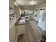 Charming kitchen with white cabinets, stainless appliances, and modern flooring at 103 Duke St, Great Falls, SC 29055