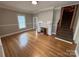 Cozy living room features hardwood floors, a fireplace, and easy access to the second story at 103 Duke St, Great Falls, SC 29055