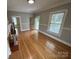 Bright living room with hardwood floors and a fireplace, perfect for relaxing and entertaining at 103 Duke St, Great Falls, SC 29055