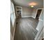 Living room offers large windows and neutral paint tones to brighten up the living space at 103 Duke St, Great Falls, SC 29055