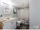 Bathroom with a white vanity, mirror, shower/tub combo and a butterfly-themed shower curtain at 106 Deaver St, Chester, SC 29706