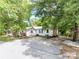 View of the front of the home with a basketball hoop and some foliage at 106 Deaver St, Chester, SC 29706