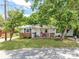 Charming single-story home featuring a cozy front porch and mature trees on a green lawn at 106 Deaver St, Chester, SC 29706