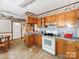 Kitchen with oak cabinets, linoleum tile, and a dining area at 106 Deaver St, Chester, SC 29706