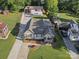 Aerial view of the property showcasing the home, spacious backyard, shed, and extended driveway at 107 Pressley St, Clover, SC 29710