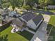 Enjoy outdoor living with a covered patio, fire pit, and lush green lawn at 107 Pressley St, Clover, SC 29710