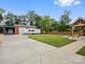 Spacious backyard with covered patio, fire pit, shed and trailer parking, perfect for outdoor activities and storage at 107 Pressley St, Clover, SC 29710