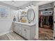 Elegant bathroom with double vanity, modern fixtures, and a walk-in closet at 107 Pressley St, Clover, SC 29710