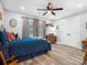 Comfortable bedroom with hardwood floors, ceiling fan and a bright window at 107 Pressley St, Clover, SC 29710