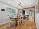 Dining room showcasing hardwood floors, natural light, and an open floor plan into the living room at 107 Pressley St, Clover, SC 29710
