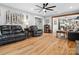 Open concept living room with hardwood floors and views into the modern kitchen at 107 Pressley St, Clover, SC 29710