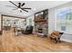 Cozy living room with stone fireplace and large windows, open to the modern kitchen at 107 Pressley St, Clover, SC 29710