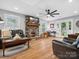 Spacious living area featuring a stone fireplace and ample natural light from surrounding windows at 107 Pressley St, Clover, SC 29710