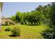 Expansive backyard showcases a wooden deck with stairs, mature trees, and a fenced-in yard at 1110 Archer Farm Dr, Salisbury, NC 28144