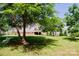 A large backyard features a well-maintained lawn, mature trees and an elevated wooden deck at 1110 Archer Farm Dr, Salisbury, NC 28144