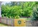 Wood fence with decorative gate, and mature trees creating a private backyard setting at 1110 Archer Farm Dr, Salisbury, NC 28144