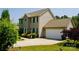Traditional two-story home with a neutral color, attached garage, manicured lawn, and well-maintained landscaping at 1110 Archer Farm Dr, Salisbury, NC 28144