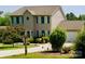 Charming two-story home with a well-manicured lawn, mature landscaping, and inviting curb appeal at 1110 Archer Farm Dr, Salisbury, NC 28144