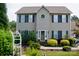 Traditional two-story home with a manicured lawn and established landscaping at 1110 Archer Farm Dr, Salisbury, NC 28144