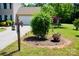 Attractive front yard landscaping with manicured shrubbery and a decorative address post at 1110 Archer Farm Dr, Salisbury, NC 28144