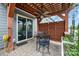 Back patio with an outdoor dining set beneath a pergola, ideal for outdoor dining at 1111 Thessallian Ln, Indian Trail, NC 28079