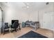 Comfortable bedroom featuring neutral walls, a ceiling fan, a twin bed and a desk area at 1111 Thessallian Ln, Indian Trail, NC 28079
