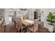 Elegant dining room featuring hardwood floors and a rustic wood table with seating for four at 1111 Thessallian Ln, Indian Trail, NC 28079