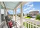 Charming front porch with rocking chairs offering a scenic neighborhood view at 1111 Thessallian Ln, Indian Trail, NC 28079
