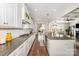 Spacious kitchen with a large island, granite counters, and access to the patio at 1111 Thessallian Ln, Indian Trail, NC 28079