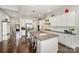 Gourmet kitchen featuring a large island, granite countertops, and stainless steel appliances at 1111 Thessallian Ln, Indian Trail, NC 28079