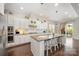 Bright kitchen with an island, granite counters, and stainless steel appliances at 1111 Thessallian Ln, Indian Trail, NC 28079