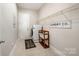 Functional laundry room with a modern washer/dryer, tile floor, and ample storage space at 1111 Thessallian Ln, Indian Trail, NC 28079