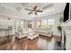 Spacious living room with fireplace, coffered ceiling, hardwood floors, and open to the kitchen at 1111 Thessallian Ln, Indian Trail, NC 28079