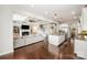 Open-concept living space with modern kitchen featuring a center island and stainless appliances at 1111 Thessallian Ln, Indian Trail, NC 28079