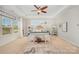 Main bedroom featuring a tray ceiling, lots of windows, and neutral colors at 1111 Thessallian Ln, Indian Trail, NC 28079