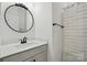 Well-lit bathroom featuring sleek vanity with modern fixtures and decorative mirror at 1318 Encore Ln, Waxhaw, NC 28173
