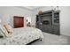 Bedroom with a built-in entertainment center and an ornate wardrobe at 1318 Encore Ln, Waxhaw, NC 28173