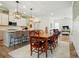 Open concept dining area with views to kitchen, living room and hardwood floors at 1318 Encore Ln, Waxhaw, NC 28173