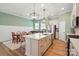 Spacious kitchen featuring a large island, stainless steel appliances, and modern lighting at 1318 Encore Ln, Waxhaw, NC 28173