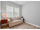 Cozy living room with neutral tones, natural light, and comfortable seating at 1318 Encore Ln, Waxhaw, NC 28173