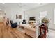 Inviting living room with plenty of natural light, hardwood floors, and neutral decor at 1318 Encore Ln, Waxhaw, NC 28173