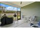 Screened porch featuring a ceiling fan, outdoor seating, and backyard view at 1318 Encore Ln, Waxhaw, NC 28173