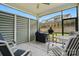 Screened porch featuring a ceiling fan, outdoor seating, and backyard view at 1318 Encore Ln, Waxhaw, NC 28173
